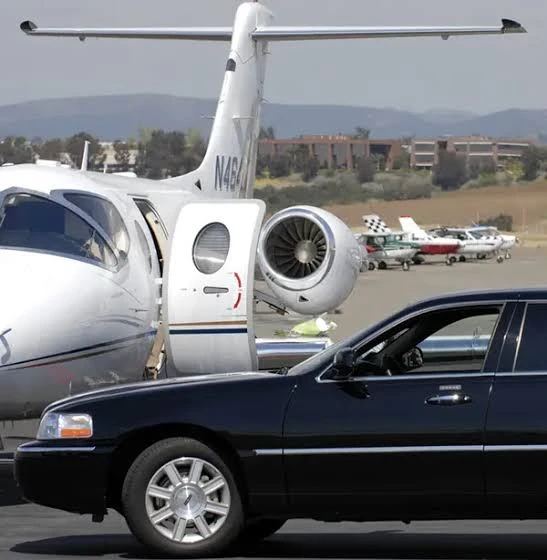 Black Car Beside Private Jet